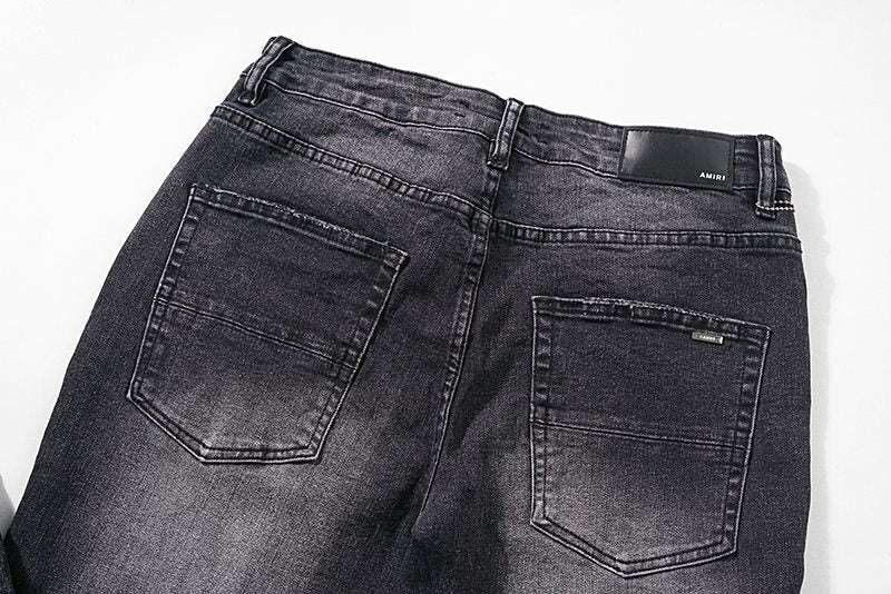 AMIRI Distressed Washed Black Graphic Jeans — detail
